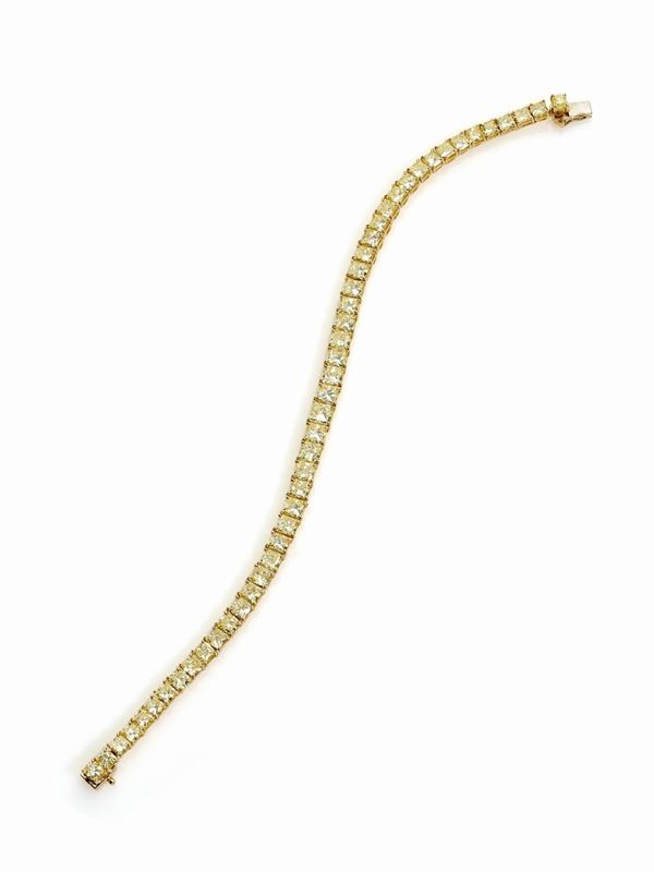 Bracciale tennis in oro giallo con diamanti fancy yellow