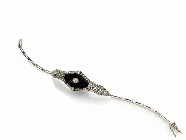 BRACCIALE IN ORO, ARGENTO E ONICE CON DIAMANTI  - Auction ASTA A TEMPO / ASTA N. 11 - Faraone Casa d'Aste