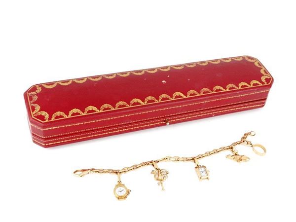 Cartier : Bracciale con charms firmato Cartier  - Asta GIOIELLI E OROLOGI  XX SECOLO - Faraone Casa d'Aste