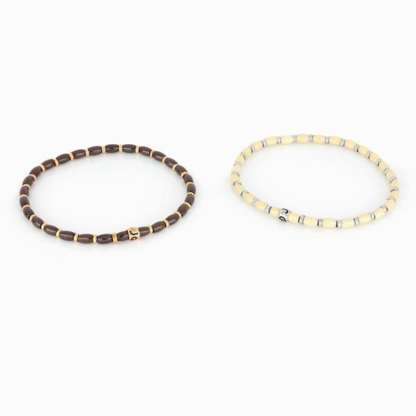 Bracciali elastici con dischetti in oro e ceramica   - Asta GIOIELLI E OROLOGI - Faraone Casa d'Aste