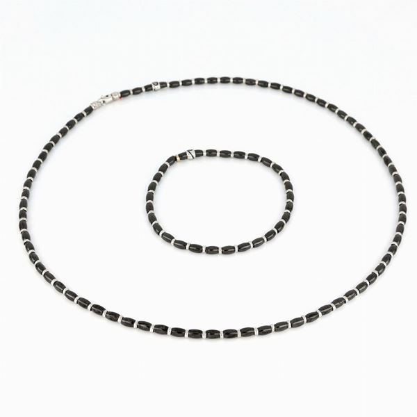 Demi-parure con dischetti in ceramica e oro