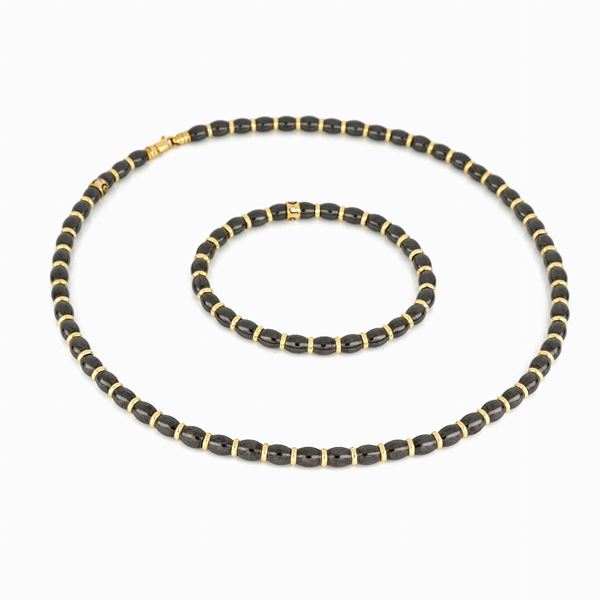 Demi-parure con discetti in ceramica e oro   - Asta GIOIELLI E OROLOGI - Faraone Casa d'Aste