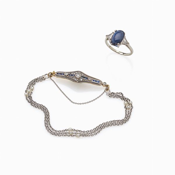 Anello zaffiro cabochon e bracciale con diamanti e zaffiri