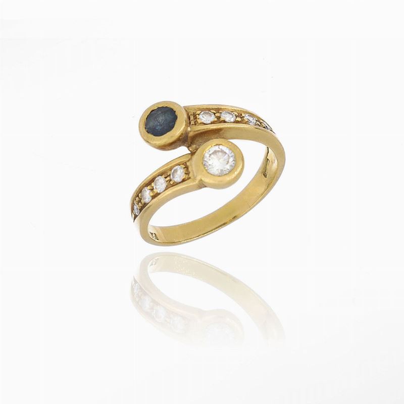 Anello Contrariè con Diamanti e Zaffiro