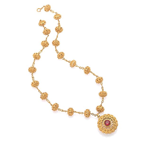 Gold necklace and granato