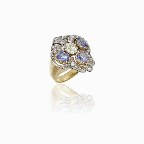 18 carat yellow and white gold ring with sapphire and diamonds