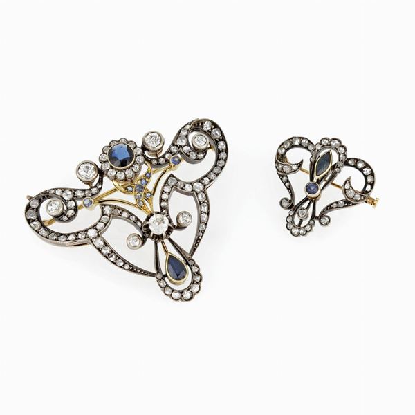 Two silver gold diamond and sapphire brooches
