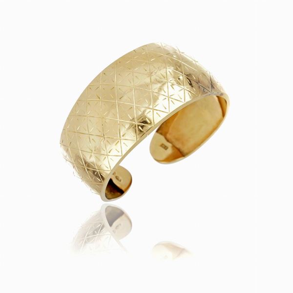 Bracciale cuff in oro  - Asta GIOIELLI E OROLOGI - Faraone Casa d'Aste