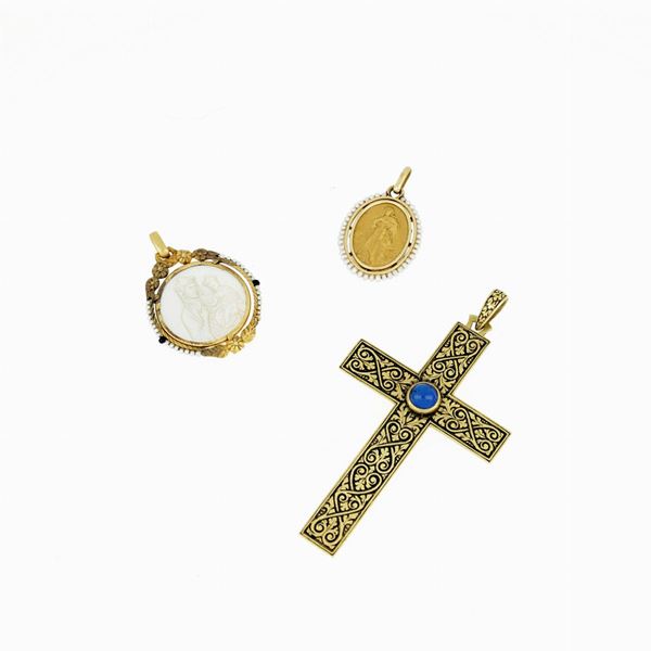 Three gold pendants
