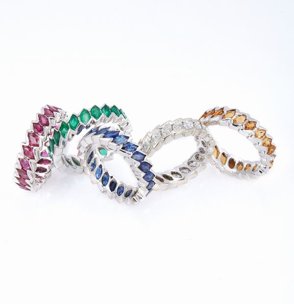 Five rings with diamonds, sapphires, rubies , emeralds