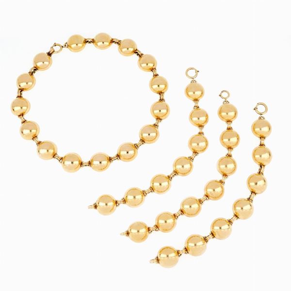 Lot of three bracelets and necklace in gold