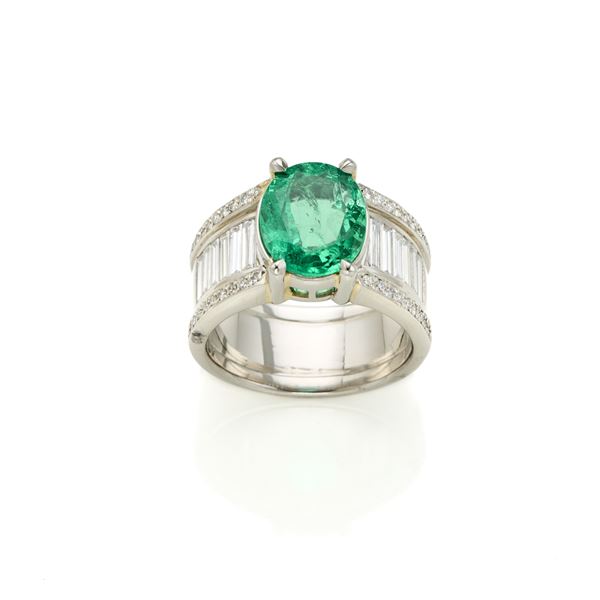 Platinum ring with emerald and diamonds