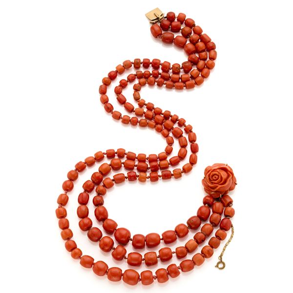 Three strand necklace of coral beads