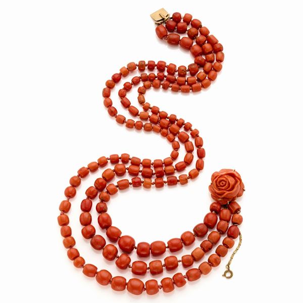 Three strand necklace of coral beads