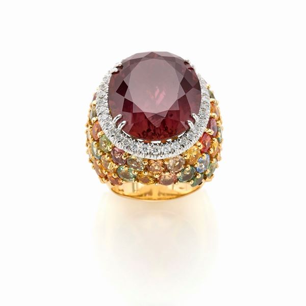 Yellow gold ring with tourmaline, sapphires and diamonds.