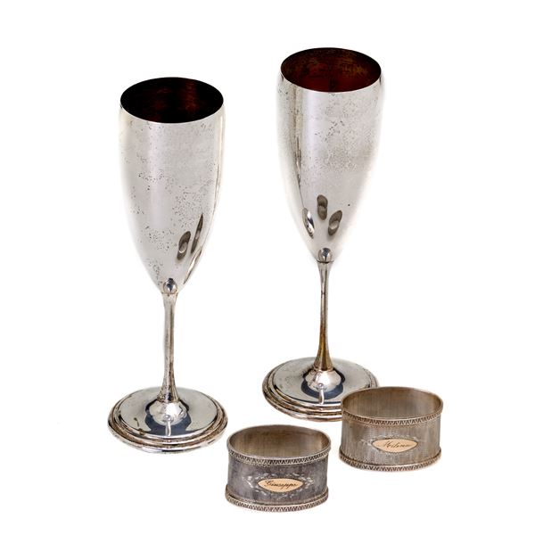 Two silver napkin holders and two silver goblets