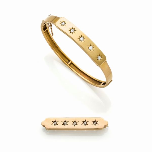 Bracciale e spilla in oro e diamanti
