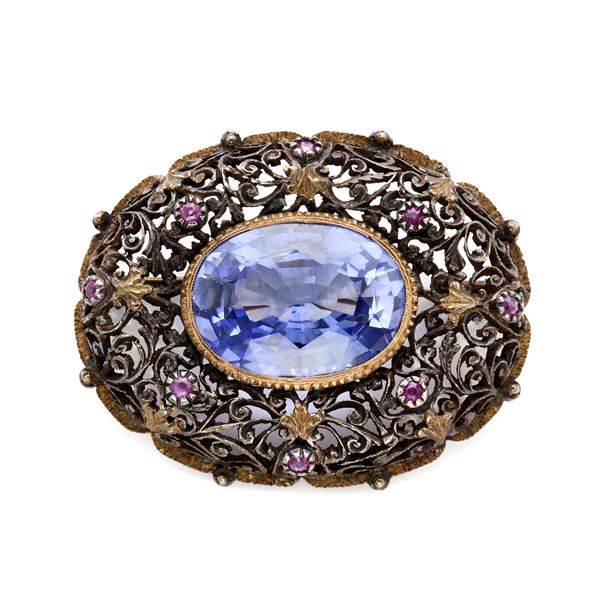 Silver and gold brooch with synthetic sapphire