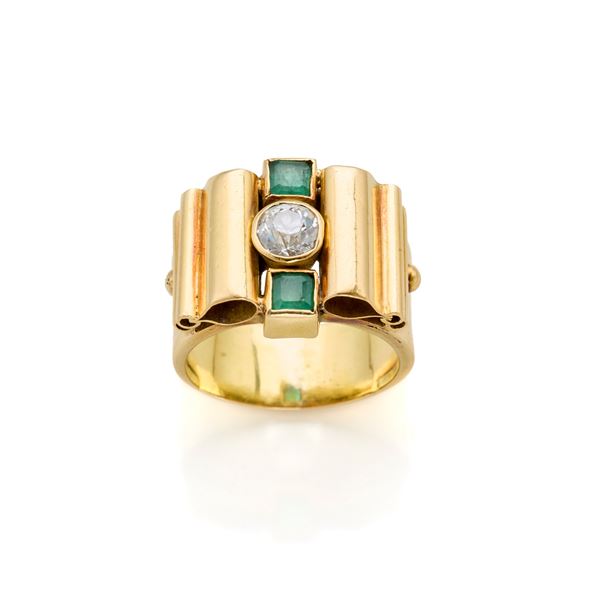 Gold ring with diamond and emeralds 