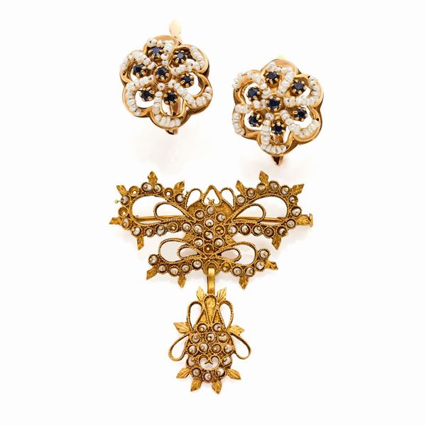 Orecchini e spilla in oro 