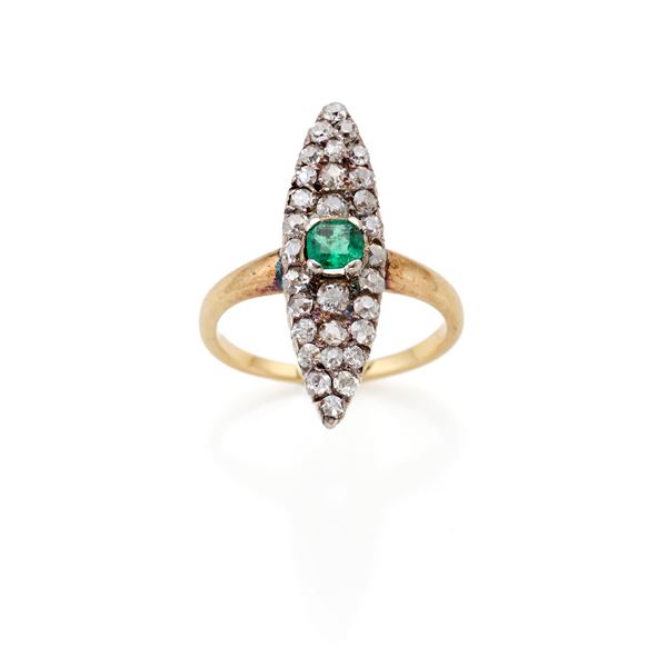 Gold and silver ring with diamonds and emerald