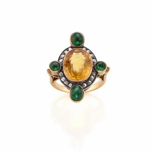 Anello in oro e argento con corindone smeraldi e diamanti 