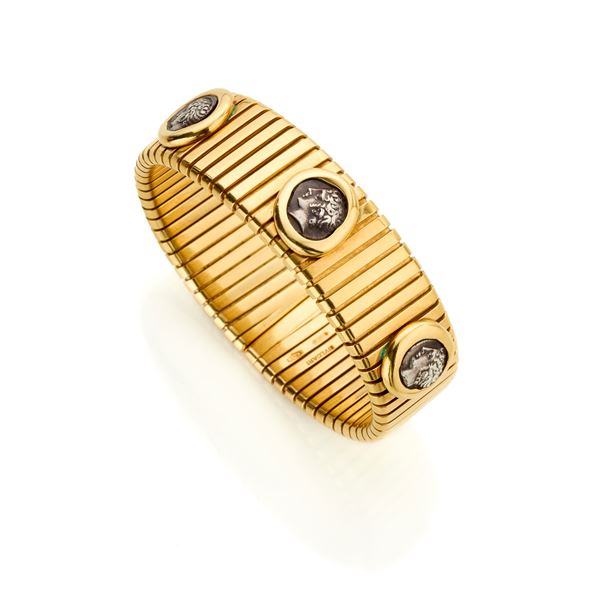 Bulgari : Bracciale Bulgari tubogas in oro con monete  - Asta GIOIELLI, OROLOGI E LUXURY GOODS - Faraone Casa d'Aste