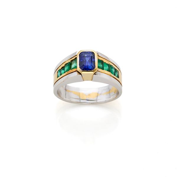 Gold ring with sapphire and emeralds