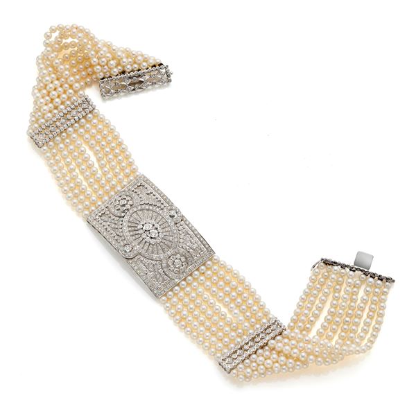 Nine-strand necklace of pearls, gold and diamonds