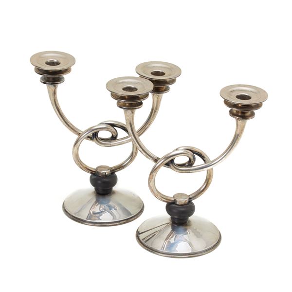 Two silver candelabra