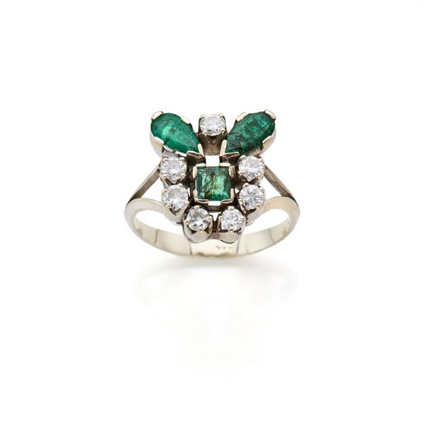 Gold ring with diamonds and emeralds