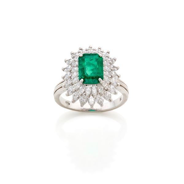 Platinum ring with emerald and diamonds