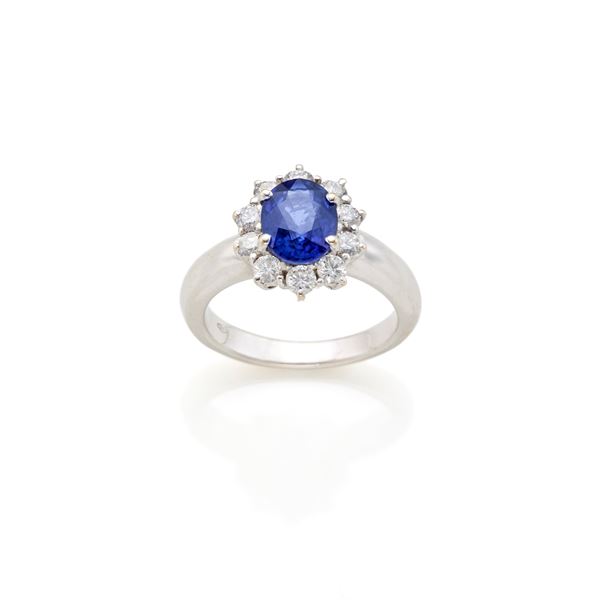 Gold ring with sapphire and diamonds