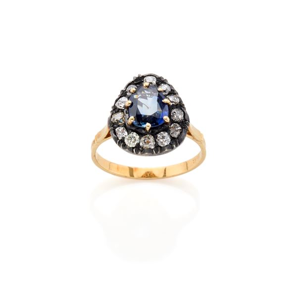 Gold and silver ring  with sapphire and diamonds