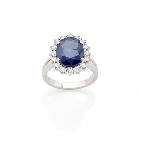 Gold ring with sapphire and diamonds