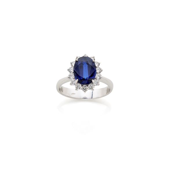 Anello in oro con diamanti e zaffiro