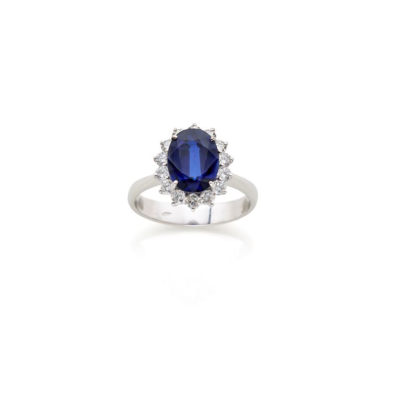 Anello in oro con diamanti e zaffiro