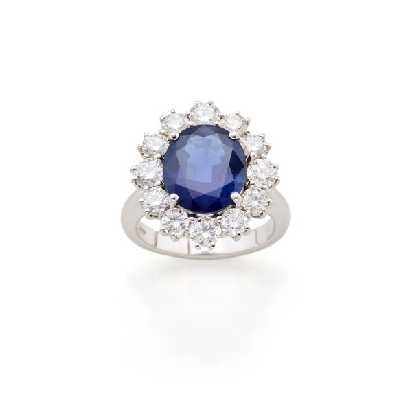 Gold ring with diamonds and sapphire