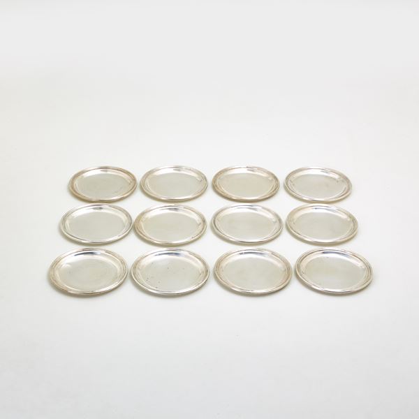 Twelve silver coasters