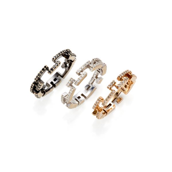 Three gold and diamond rings