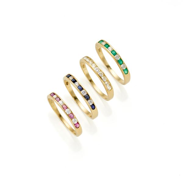 Lot consisting of four gold rings with gemstones