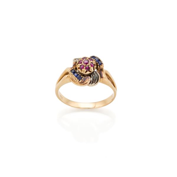 Anello in oro con conrindoni sintetici
