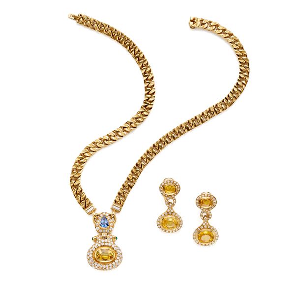 Demi parure in oro con diamanti e zaffiri 