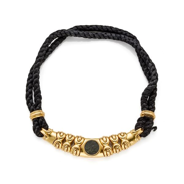 Gold necklace with coin