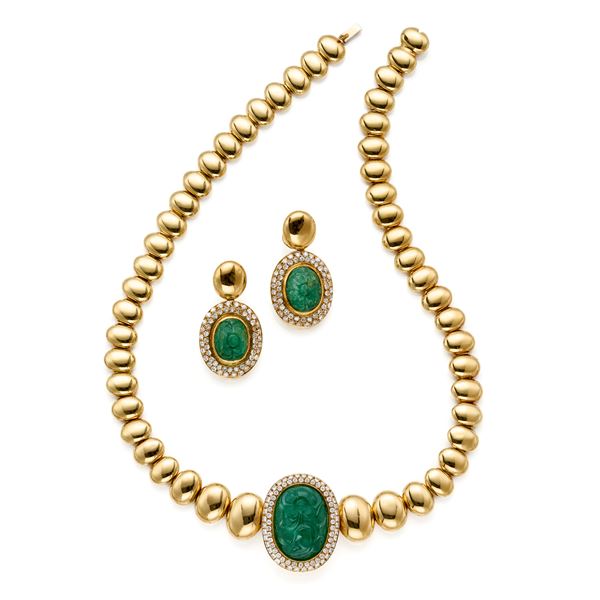 Demi parure in oro con diamanti e smeraldi