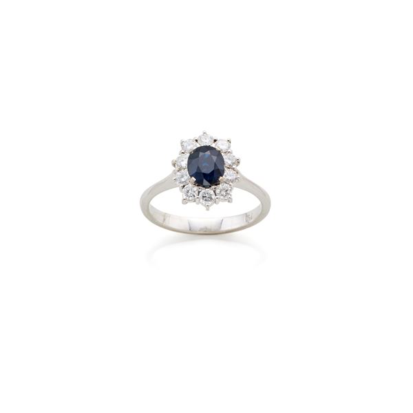 Gold ring with sapphire and diamonds 