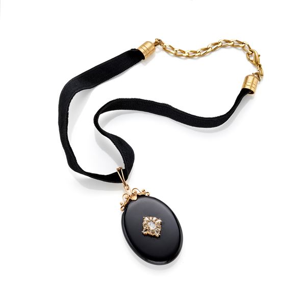 Gold onyx and diamond pendant