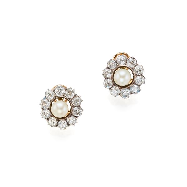 Gold and silver earrings with diamonds and natural pearls