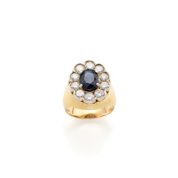 Anello in oro con diamanti e zaffiro