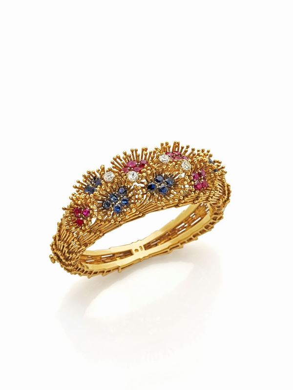 Bracciale rigido in oro giallo e gemme